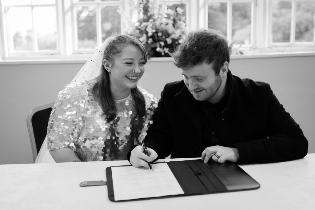 Signing the Wedding Register at Cockington Court