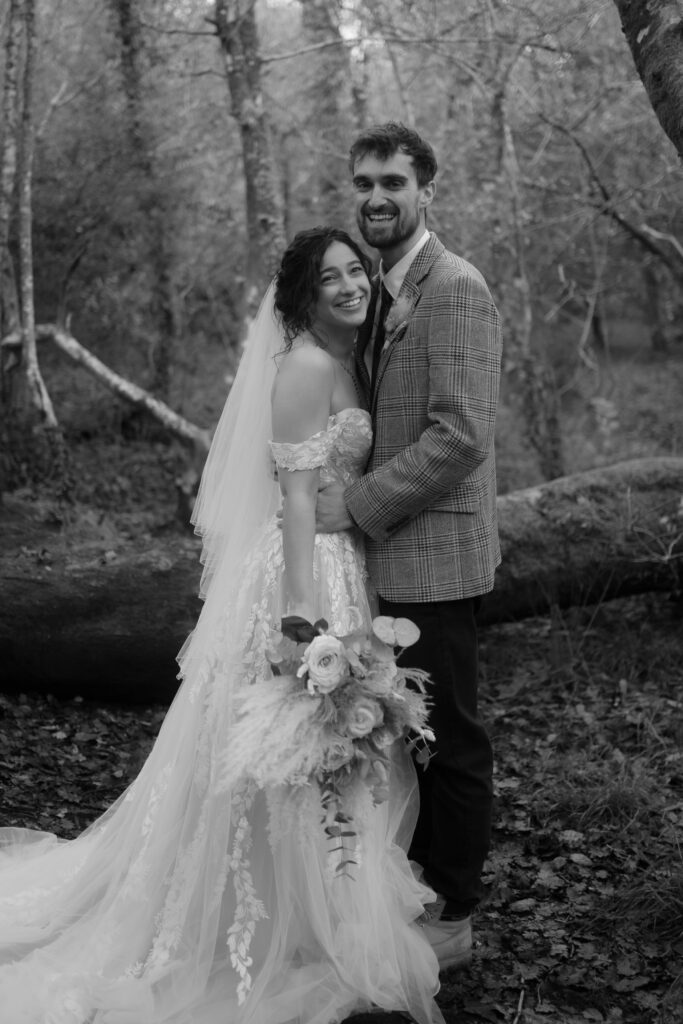 Happy wedding couple in forest